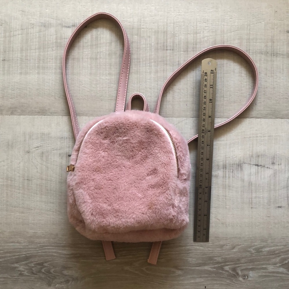 Mini pink fluffy backpack with gold detailing